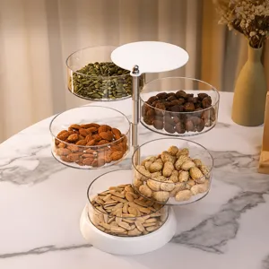 Transparante multi-laags roterende opbergdoos voor snacks en kleine accessoires.