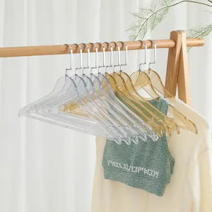 Perchas transparentes con purpurina de acrílico elegantes para escaparate de ropa en la boutique