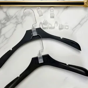 Plastic hanger connector hooks for closet organization, cascading space saving clothes hangers.