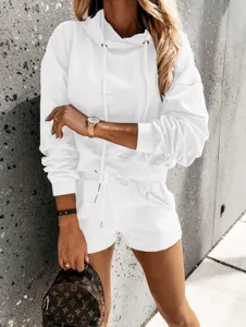 Detailed view of casual white hooded sweatshirt and matching shorts tracksuit set for women.
