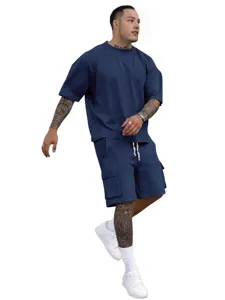 Men summer casual sportswear set with loose short sleeve t-shirt and cargo shorts for daily wear.
