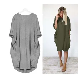 Detail view of the loose long-sleeve pocket dress, showcasing fabric and relaxed fit features.
