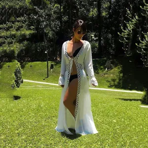 Women white long beach cover up cardigan with hollow out lace details, ideal for summer vacation.