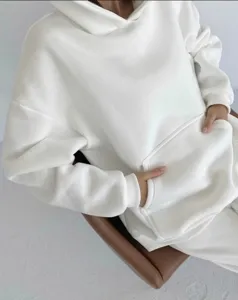White oversized long sleeve hoodie with front pocket, comfortable casual wear for women.