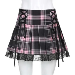 Black pink plaid pleated skirt detail view, showing side lace-up ribbons and lace hem design.