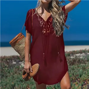Detail shot of the V-neck lace spliced beach cover-up dress in burgundy, resort style.