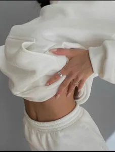 Detail shot of women's casual solid white hoodie set showing soft fabric texture and fit.