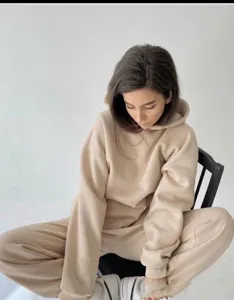 Casual beige long sleeve hoodie and sweatpants set detail showcasing soft cotton fabric texture and comfortable fit for daily wear or lounging.