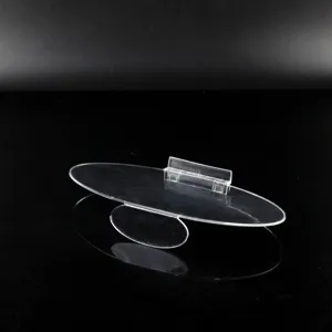 Supporto per scarpe in acrilico trasparente a forma di uovo con clip per etichetta.