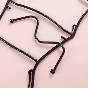 Black plastic swimsuit hanger display rack for women swimwear store retail organization.