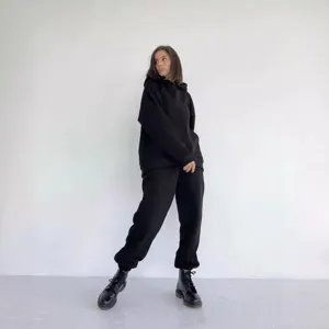 Women solid black long sleeve hoodie and sweatpants casual tracksuit set, main view.