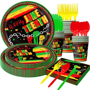 Juneteenth party tableware detail view featuring themed plates, cups and colorful cutlery sets.
