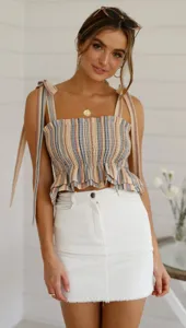 Summer striped strappy crop top with playful shoulder ties and ruffled hem, stylish apparel.
