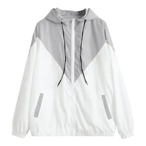 Color blocked hooded windbreaker jacket for women with zipper and drawstring details.