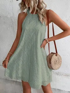 Summer women's sleeveless halterneck eyelet lace mini dress detail, solid color design.