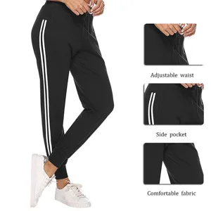 Women casual sweatpants black jogger pants with white side stripes active gym trousers.