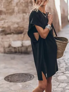 Casual black short sleeve split midi dress for women, stylish crewneck street wear outfit.