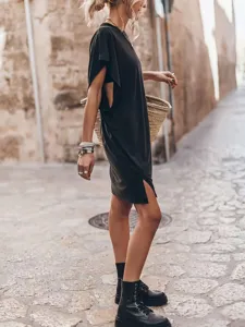 Casual black short sleeve midi dress with side slit, comfortable summer wear for women.