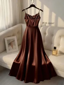 Elegant brown satin slip dress with pearl straps and waist zipper for women evening party.