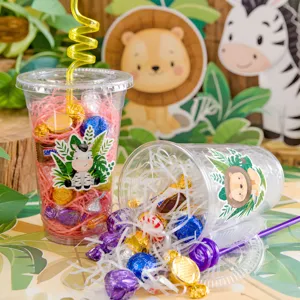 Animal themed plastic party cups with straws, candy and paper shred fill for kids birthday.