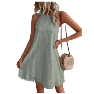 Summer women's solid color sleeveless halter neck lace cutout mini dress with straw bag.