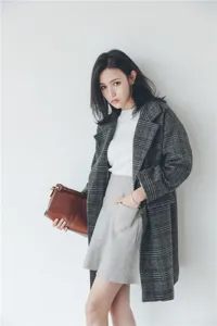 Stylish women's grey plaid woolen coat, mid-length thick winter outerwear for chic daily wear.
