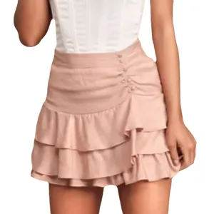 Women pink tiered ruffle mini skirt side buttons high waist cute sweet summer beach apparel style.