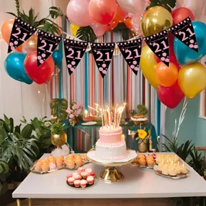 Detailed setup view showing black 21st birthday triangular banner flags decorated in a party room.