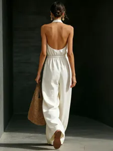 White halter backless jumpsuit detail showcasing elegant design and summer chic style.