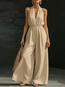Elegant beige halter neck sleeveless wide leg jumpsuit showcasing chic summer style