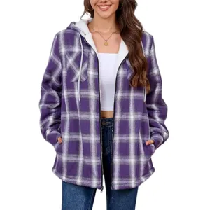 Detail shot of women's purple plaid fleece-lined hooded jacket zipper pockets casual wear.