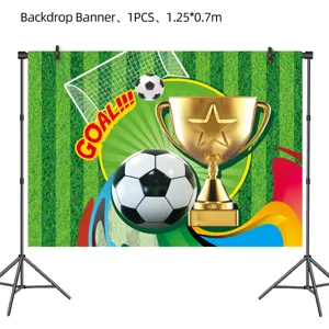 Detail view of football theme backdrop banner featuring goal, soccer ball and golden trophy.