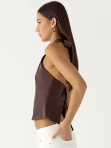Side view detail of the brown satin halter top, showcasing the elegant backless lace-up design.
