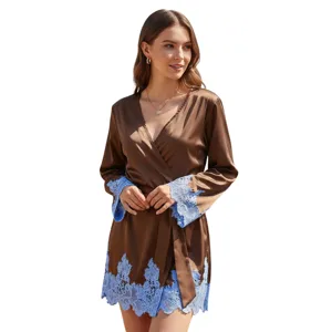 Close-up detail of women's silk sexy bathrobe featuring elegant blue lace trim on cuffs.