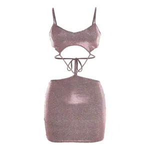 Sparkly pink crop top and mini skirt detail showing cutouts, straps, and glitter fabric.