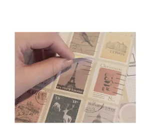 Vintage postage stamp stickers detail view, showing peel-off backing and nice paper texture.