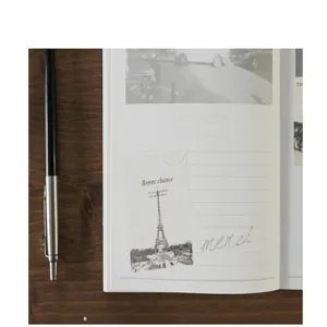 Vintage stamp style sticker detail view featuring Eiffel tower and elegant French text.