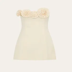 Detailed view of elegant beige strapless mini dress featuring stunning 3d fabric rose floral bust.