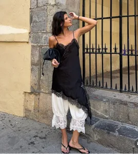 Chic European style black lace camisole layered with white bloomers for women fashion.