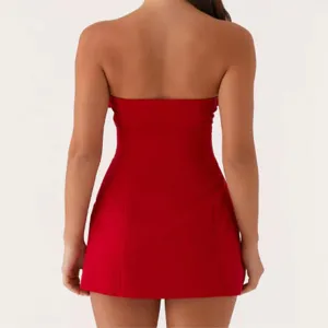 Red strapless mini dress back view showing slim waist-cinching summer fashion fit.