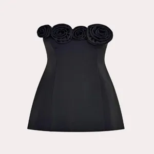 Detailed view of the elegant black strapless dress featuring chic 3D rose floral neckline.