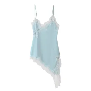 Detail view of women asymmetric lace camisole top in light blue color with delicate straps.