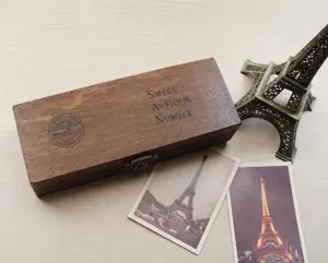 Detailed view of the vintage wooden stamp box with letter and number stamps for journal crafting.