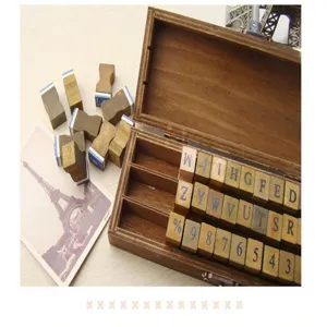 Vintage wooden stamp set with alphabetical letters and numbers in a retro storage box diary DIY