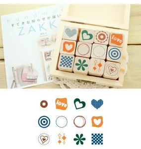 Wooden journal stamps set with cute patterns, detail view showing stamp designs and wooden box.