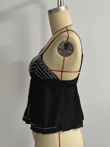 Black beaded V-neck short camisole top detail view, featuring delicate silver bead embellishment.