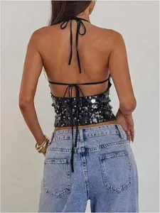 Black sequin halter crop top detail featuring backless design and sleeveless style for summer.