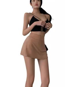 Damen Hohe Taille Tennis Rock Set sexy aktives Crop Top und Plissee Skort Outfit Hauptansicht.