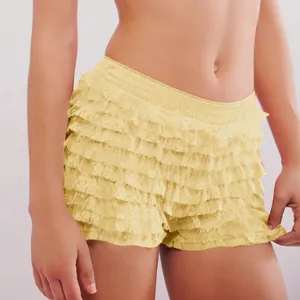 Detailed view of women yellow low waist tiered ruffle lace Lolita shorts and beach pants.
