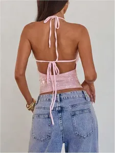 Back detail of sexy pink sequin halter crop top, backless sleeveless design for summer.